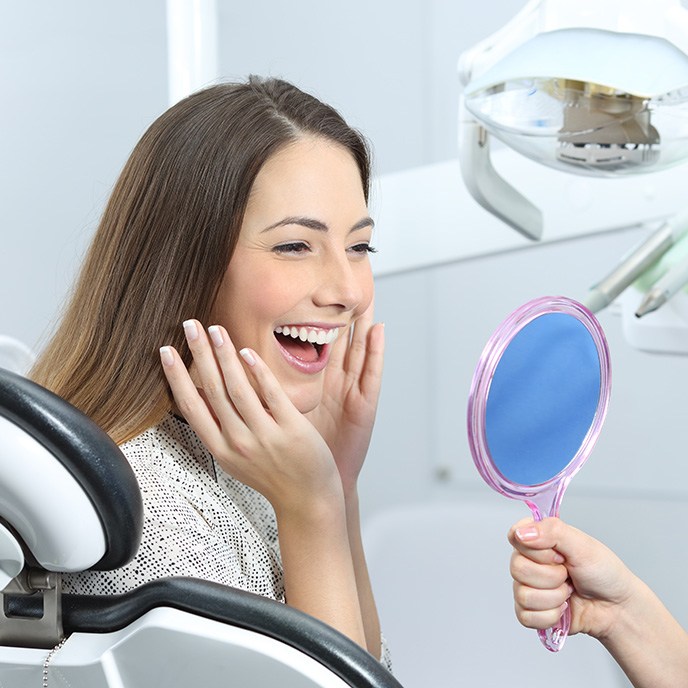 Female patient smiling at the cost of teeth whitening in St. Johns