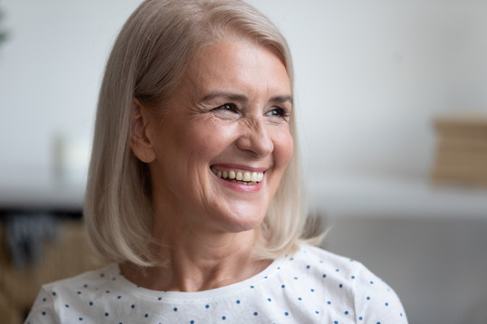 closeup of person smiling with dentures 